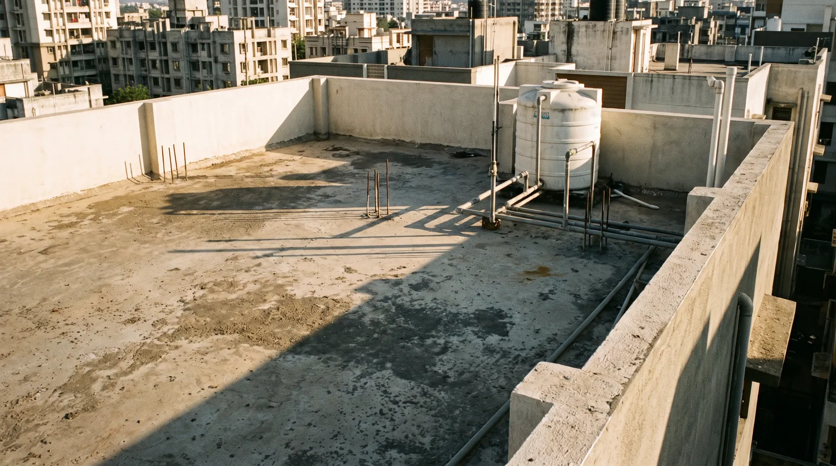 Bare concrete rooftop before garden design